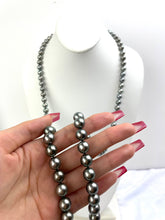 Mikimoto Tahitian Black pearl strand with original box and paperwork