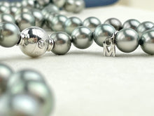 Mikimoto Tahitian Black pearl strand with original box and paperwork