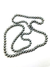 Mikimoto Tahitian Black pearl strand with original box and paperwork
